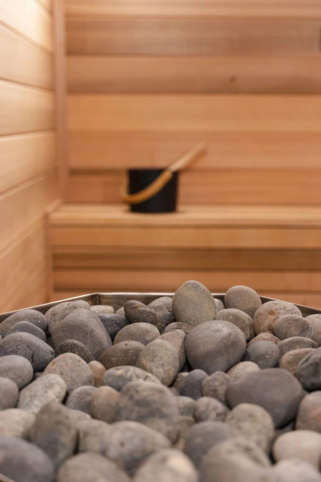 Sauna stones in a cedar sauna
